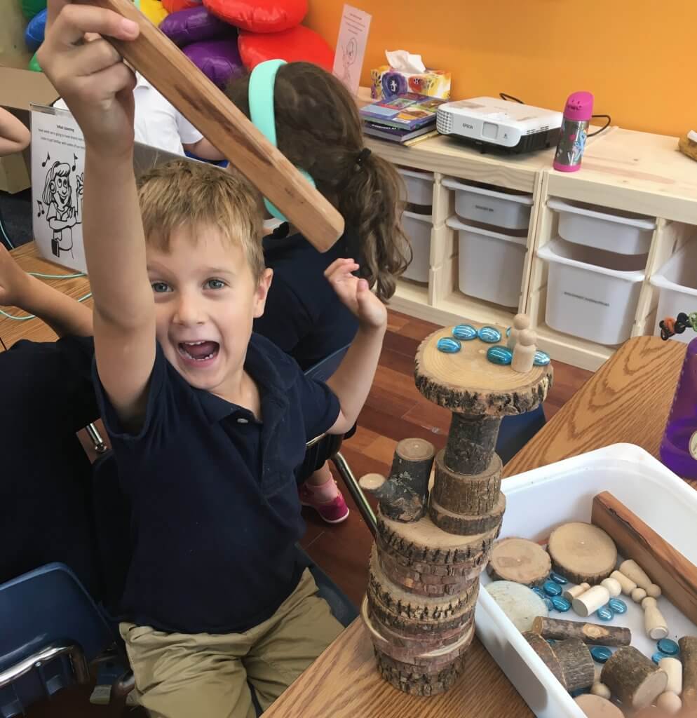 Shorashim (1st grade) student joyfully building