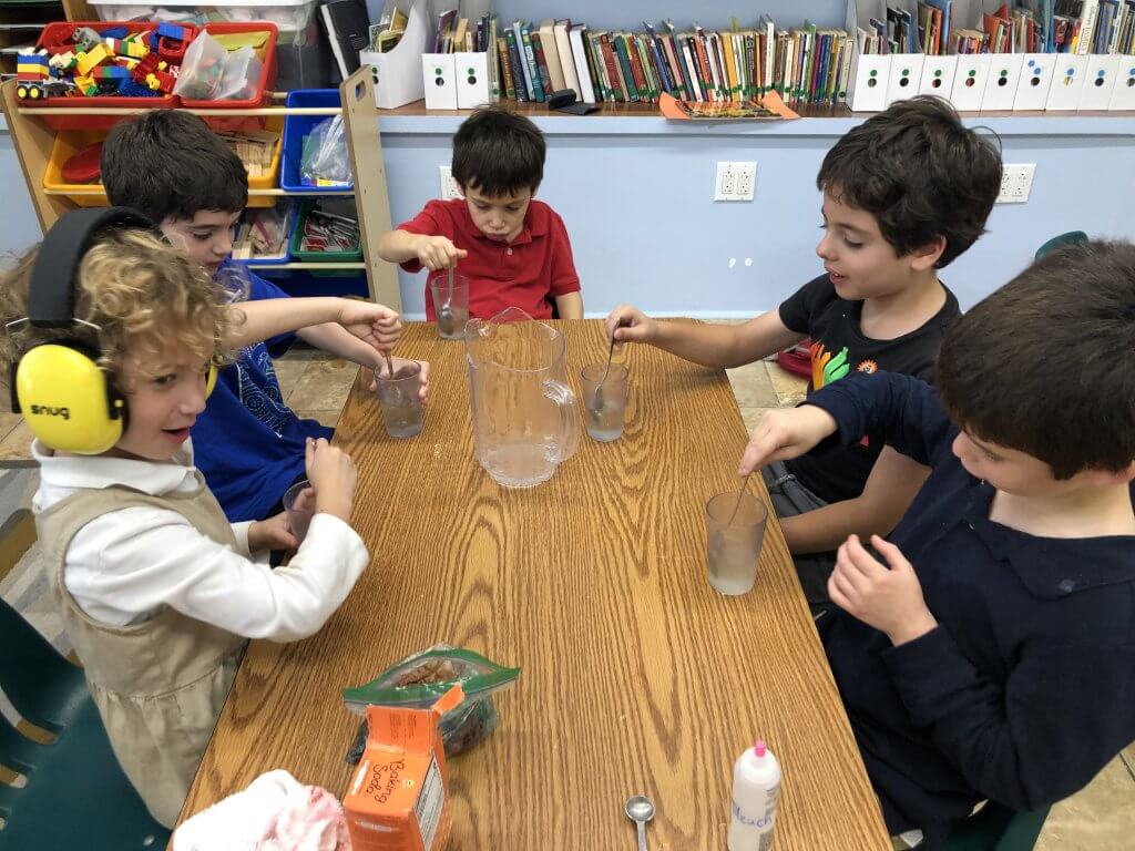 Kiddos turn colorful water clear again and imagine starting over with a clear slate.