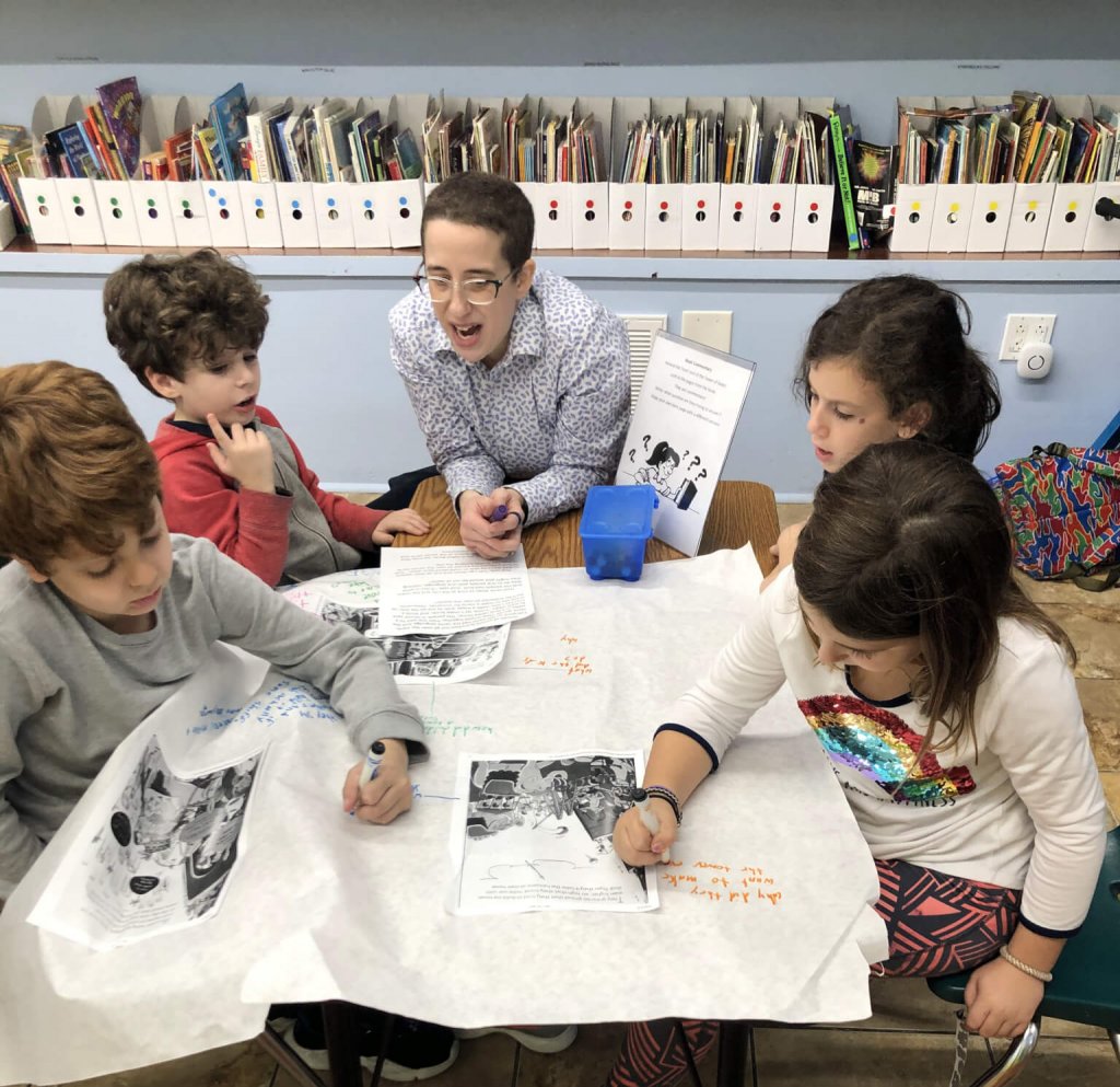 Beverly helps a group of students practice their textual commentary skills.