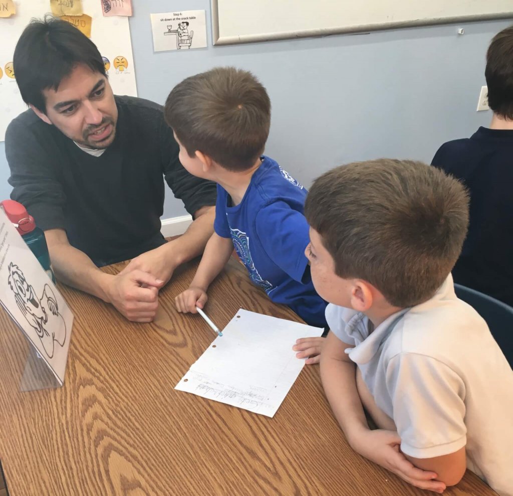 Joe and two second graders brainstorm a new get-quiet chant.