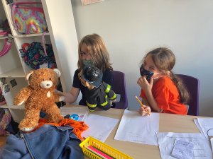 Gideon and Lucy during PBL with puppets in hand